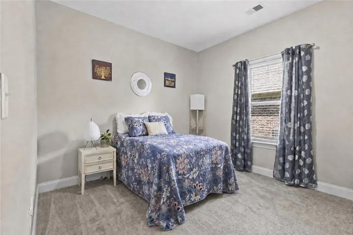 Just off the kitchen is a large guestroom that could also be used as an office or playroom.