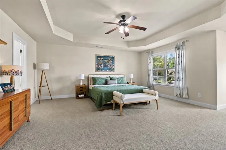 Upstairs, the main bedroom offers an impressive amount of space, with a tray ceiling, large window and plenty of room for substantial furniture.