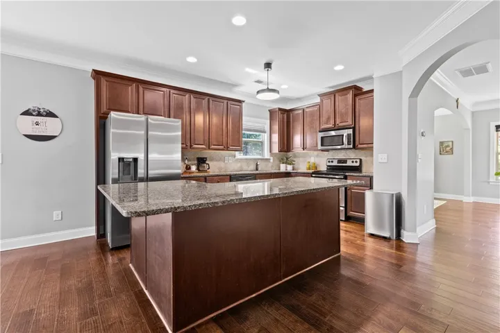The kitchen island has plenty of room for stools if you need extra seating.