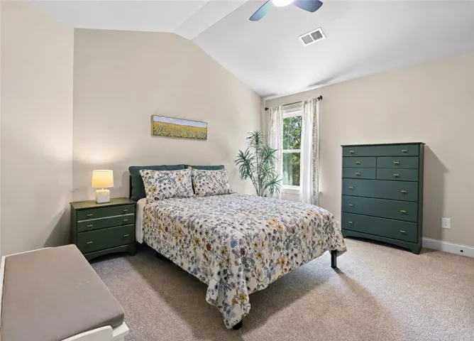 The last upstairs bedroom has a vaulted ceiling, generous wall space and a large closet.
