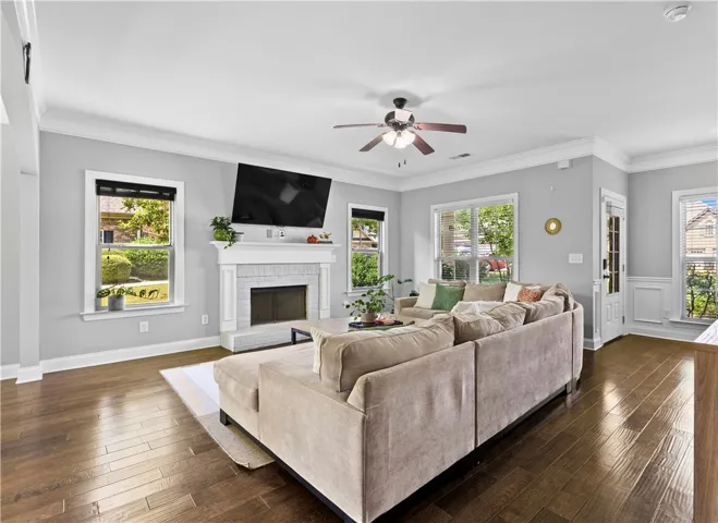 The living room is spacious enough for a  large sectional and coffee table with plenty of space left for walkways.