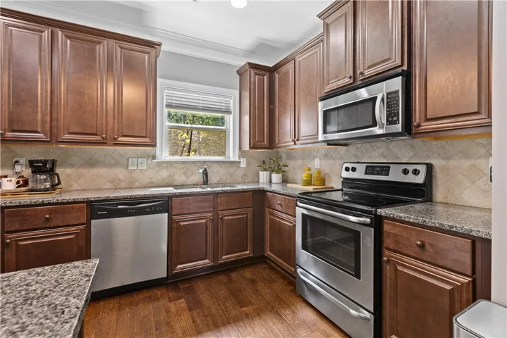 The all electric kitchen has a stove, built-in microwave and plenty of counter space.  The refrigerator will remain with the home.