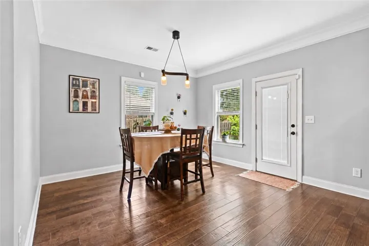 Breakfast area also features access to the backyard and has updated lighting.  This space is large enough to accommodate a large dining table.