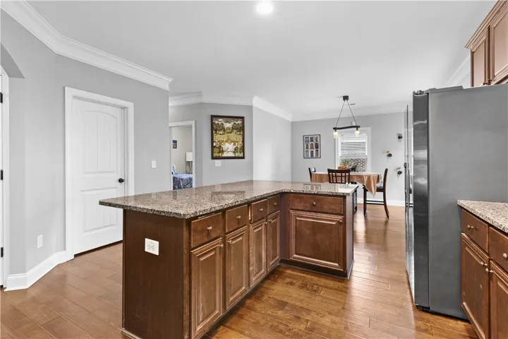 The island has plenty of extra storage space with additional cabinets and drawers.
