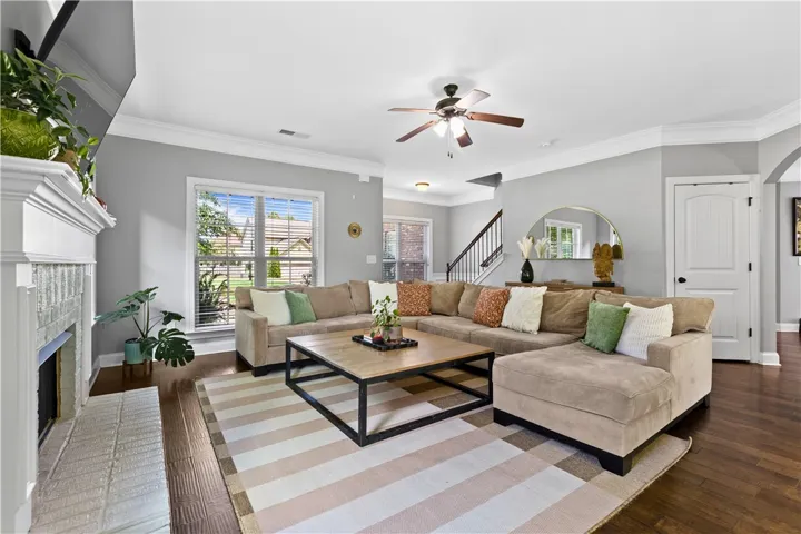 The living room feels spacious and comfortable with abundant natural light and open sightlines that keep the home feeling connected.