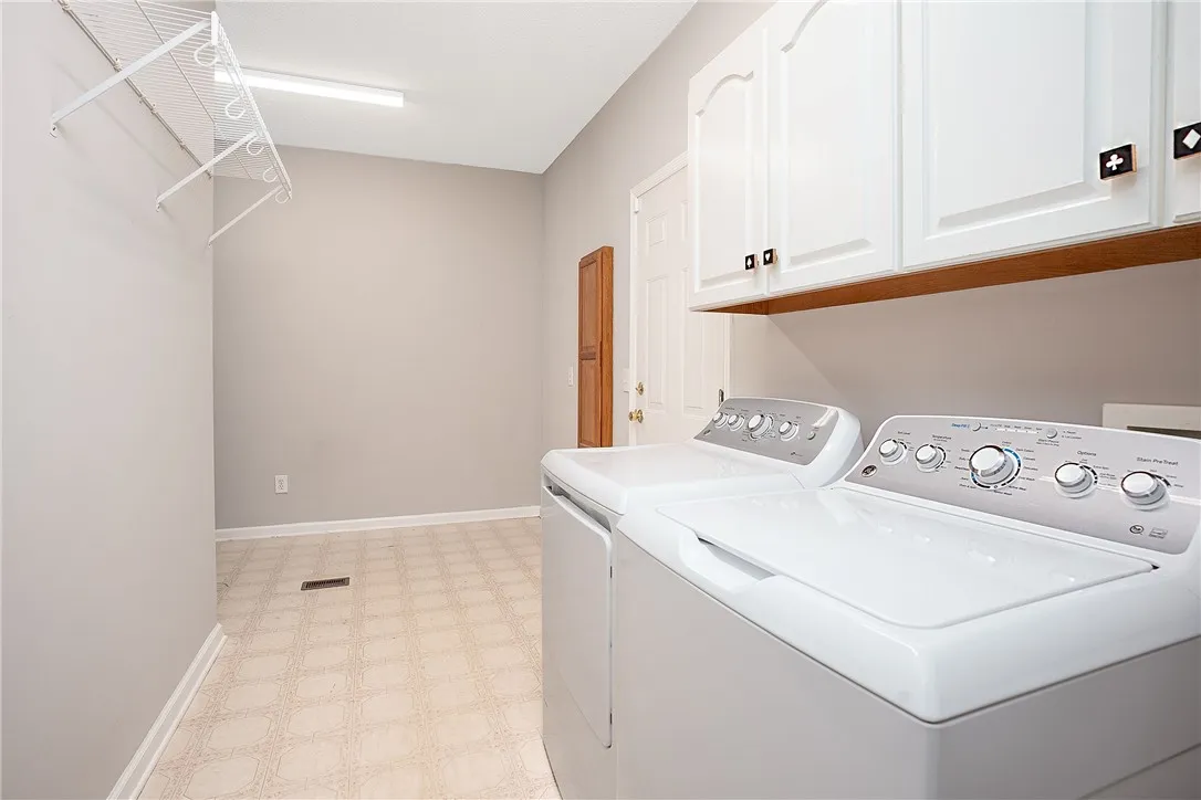 Laundry Room with Additional Garage Entrance and TONS of Storage