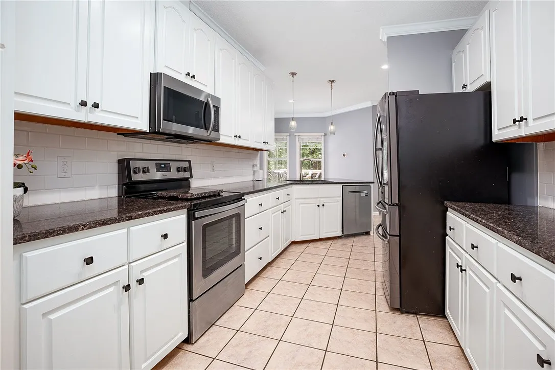 Kitchen with Tile Backsplash and Granite Countertops!