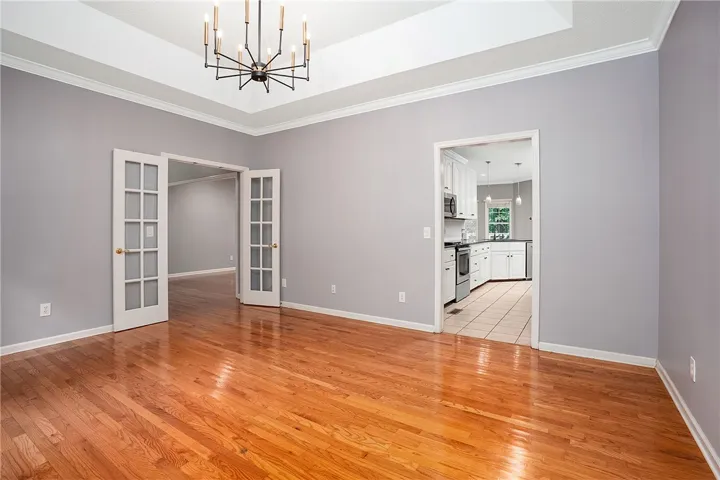 Dining Room with French Doors and Easy Access to Kitchen