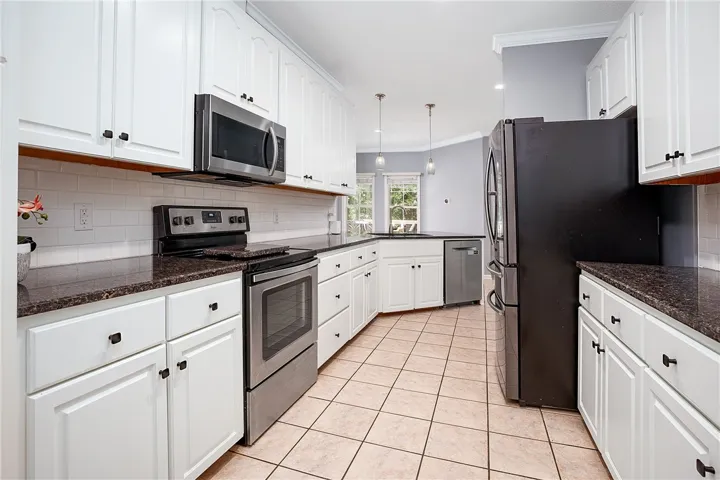 Kitchen with Tile Backsplash and Granite Countertops!