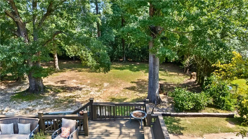 backyard  shaded by massive oak trees
