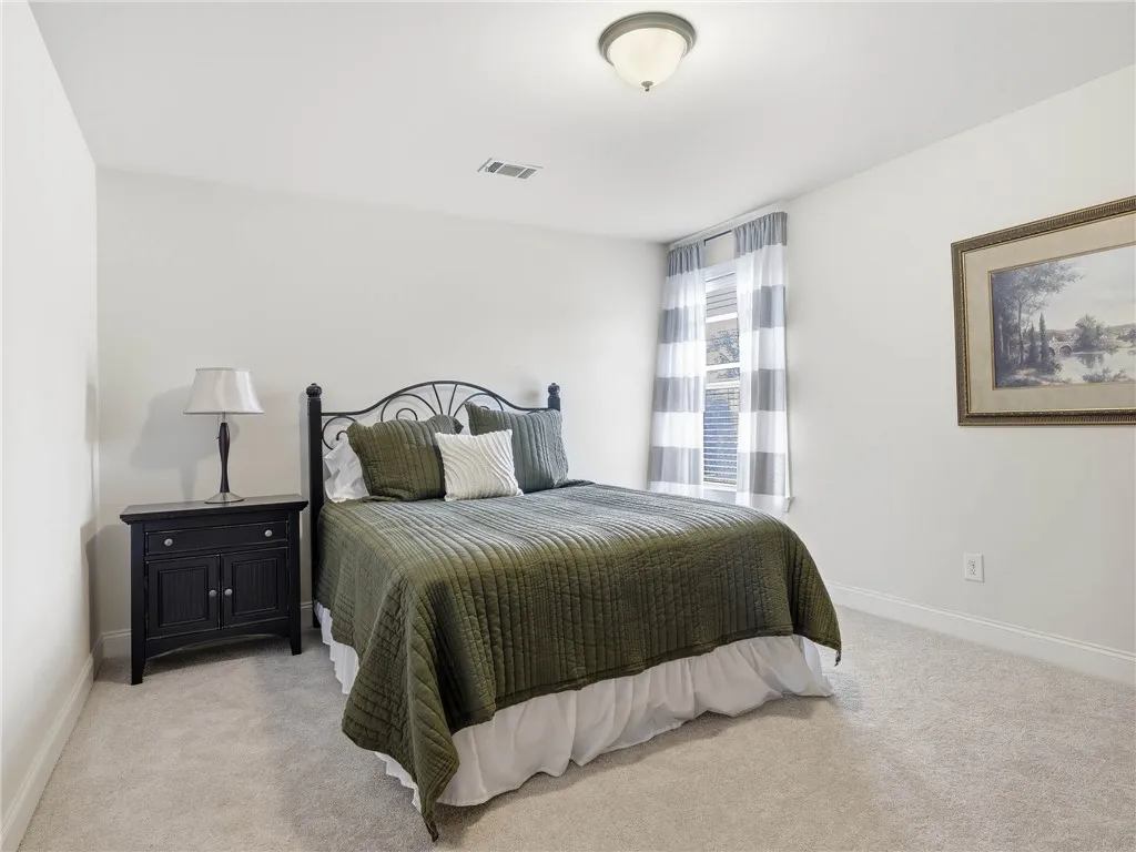 Set at the back of the home with a view of the great yard, bedroom 4 offers a generous closet and convenient attic access.