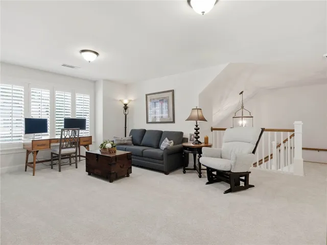 Located at the top of the stairs, the spacious loft provides a versatile spot for all ages.