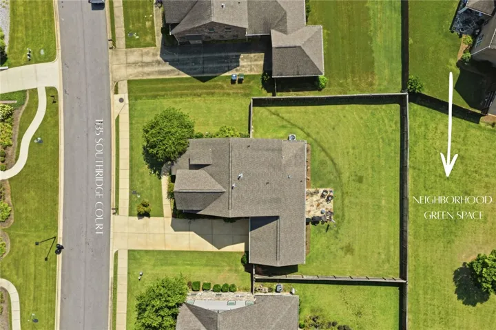 With dedicated green space behind it, this home enjoys a standout setting among its many highlights.