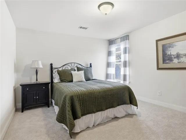 Set at the back of the home with a view of the great yard, bedroom 4 offers a generous closet and convenient attic access.