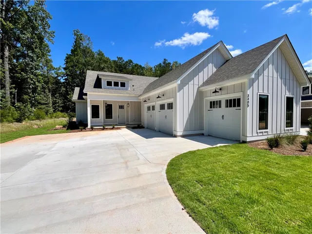Attached 2 Car Garage + Golf Cart Garage!