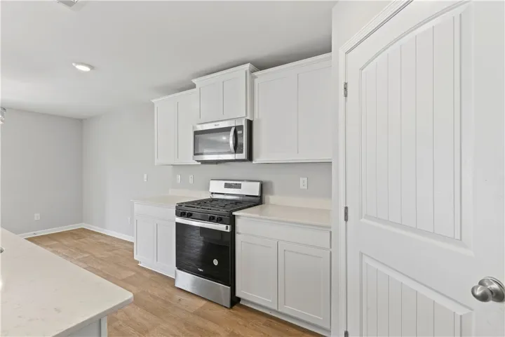 Kitchen with stainless steel appliances and walk in pantry