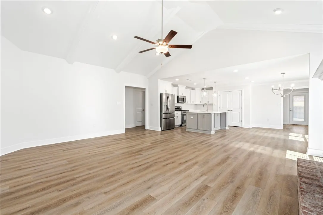 Open floor plan with nice flow between living room, breakfast/dining area, and kitchen
