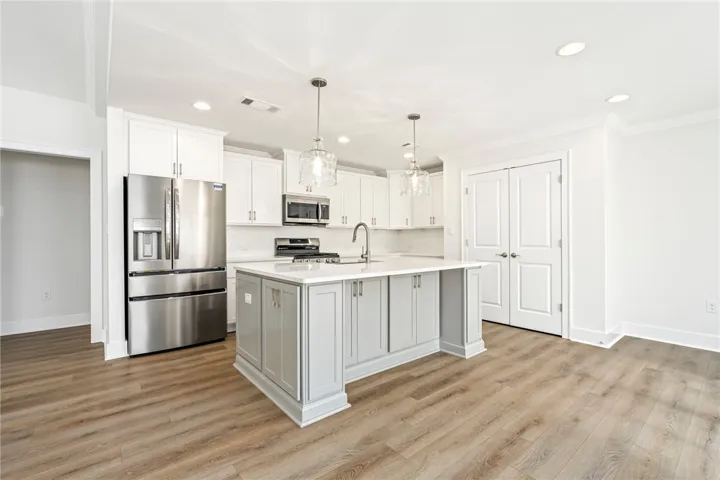 Fabulous big island with lots of storage and quartz counters.