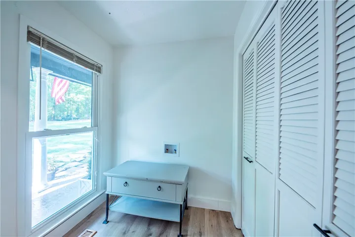 laundry room with storage