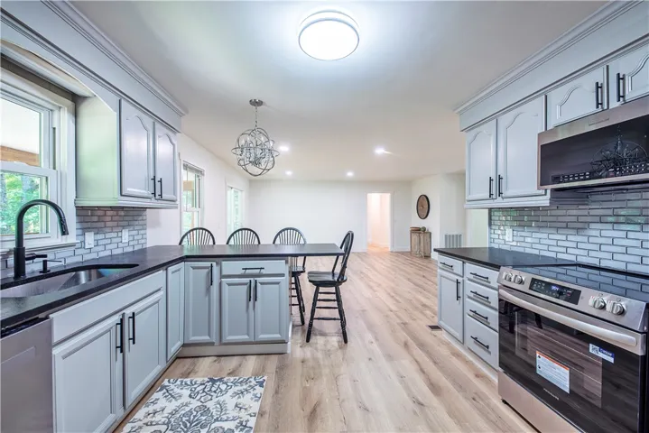 An open kitchen layout flows seamlessly into a spacious dining area