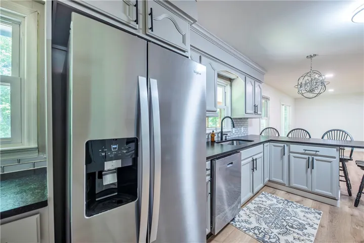 Modern cabinetry and stone countertops highlight this updated kitchen space.