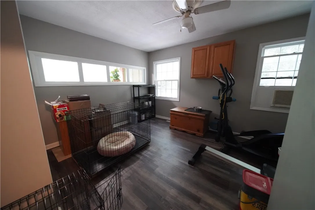 Multi-use bonus room features low-maintenance plank flooring and generous natural light.