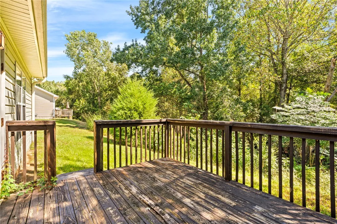 Rear patio / deck with wooded view for added privacy
