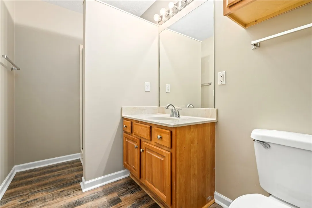 Maple cabinetry in the primary bathroom