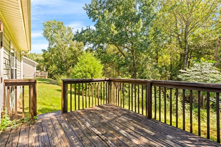 Rear patio / deck with wooded view for added privacy