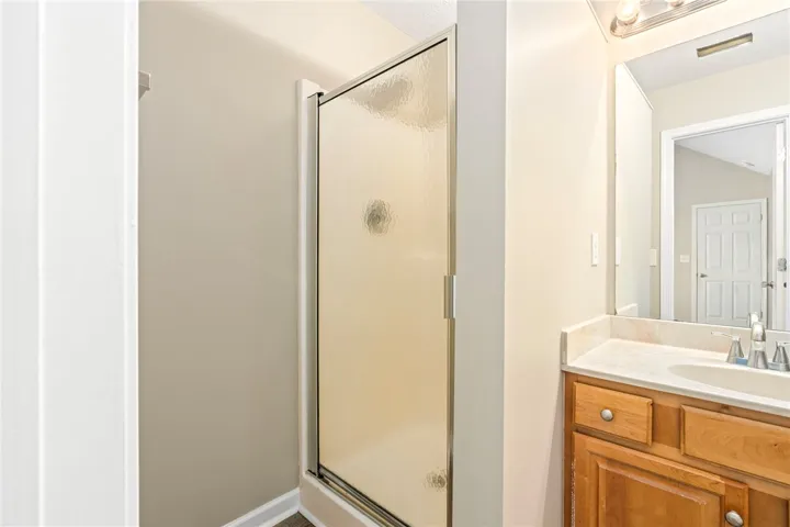 Enclosed shower in the primary bathroom