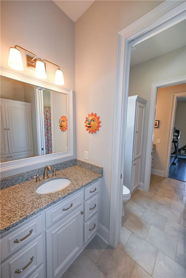 Jack and Jill bath connecting main level bedrooms 2 and 3.