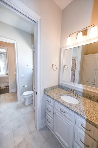 Jack and Jill bath connecting main level bedrooms 2 and 3.
