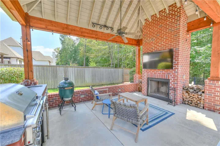 Cabana with integrated media wiring and wood-burning fireplace.