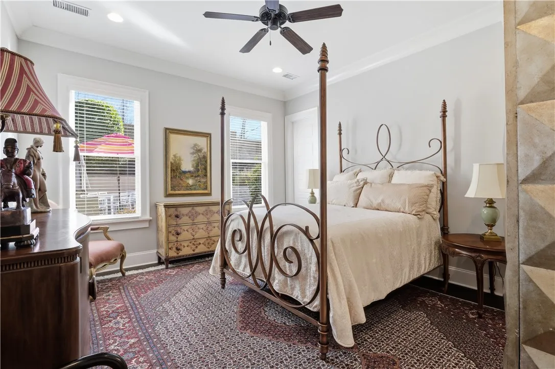 Bedroom 2 sits in a separate bedroom wing and includes an en suite bath and walk-in closet.