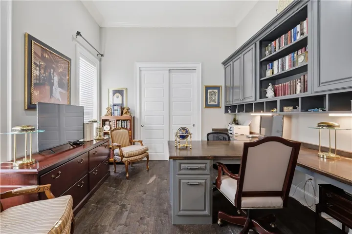 The study offers a generous footprint, accommodating a partner’s desk, built-in shelving, and additional furnishings to accommodate guests.