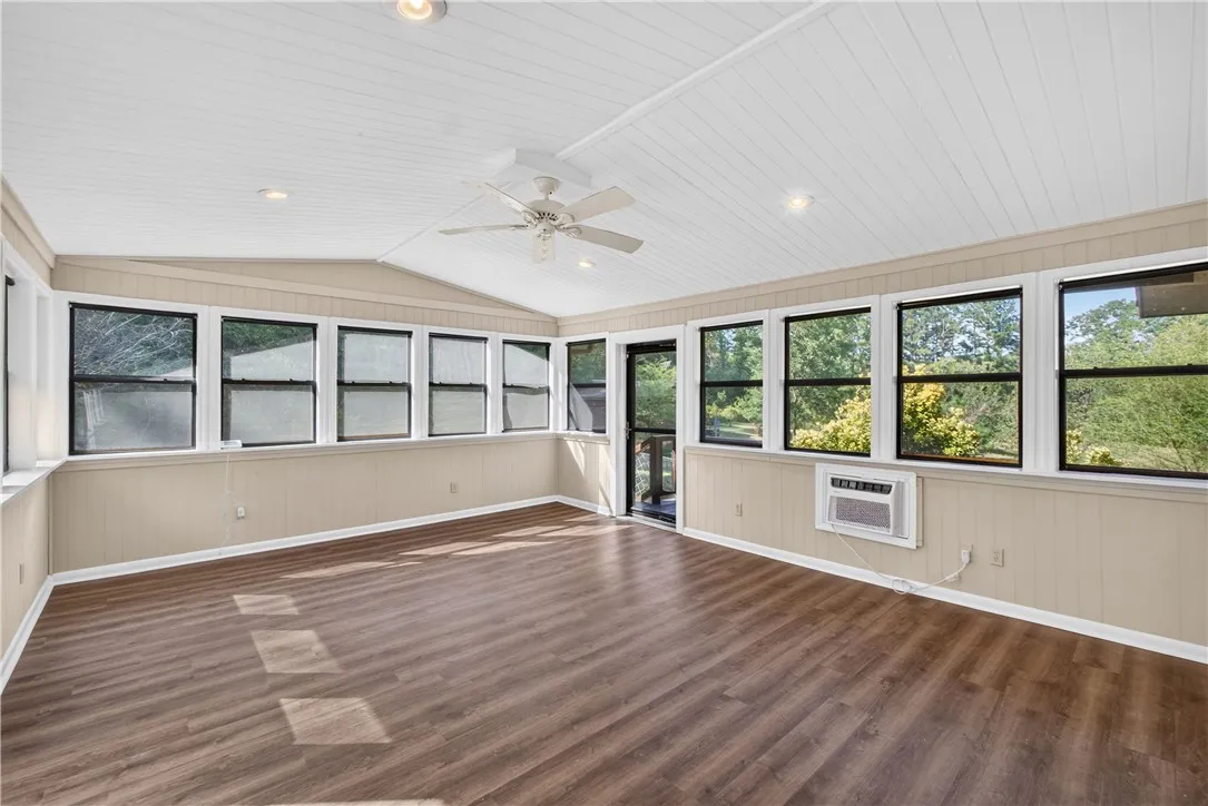 Windows galore in the sunroom with blinds