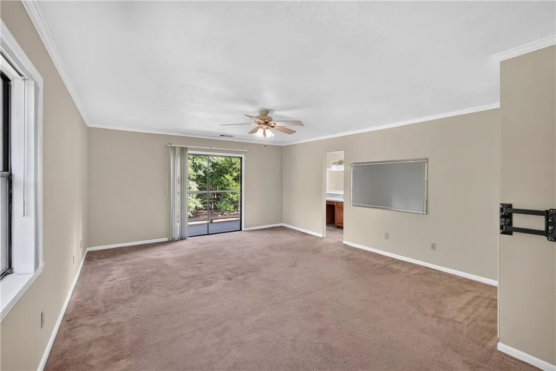 Large Primary with sliding doors to new deck