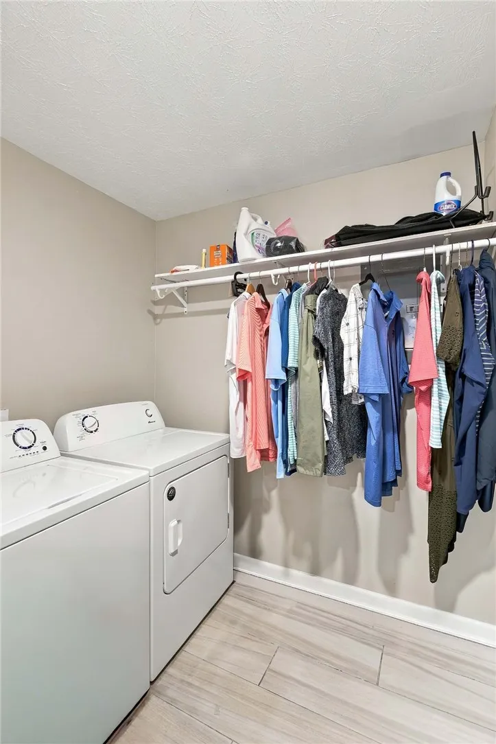Functional tile flooring and useful built-in shelving define this convenient utility space.
