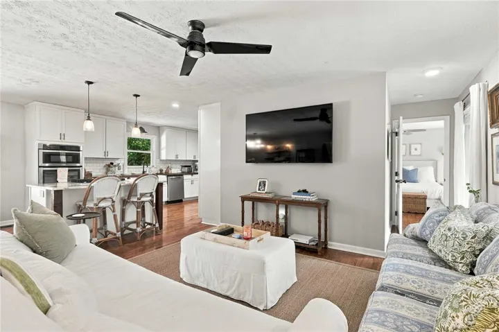An open floorplan seamlessly connects the living space with a modern kitchen.