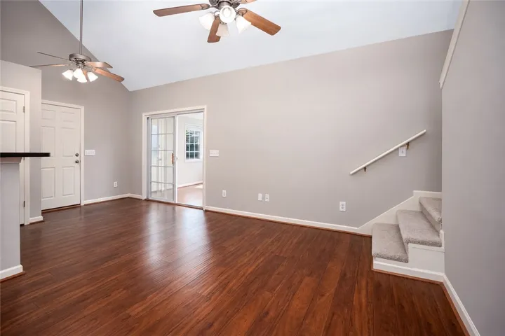 Wide Open Living Space into Sunroom and Kitchen