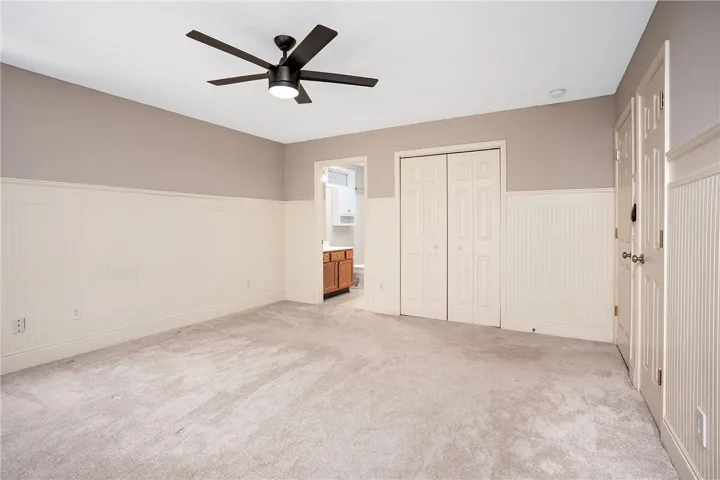 Primary Bedroom Into En-Suite Bathroom.  Multiple Closets!