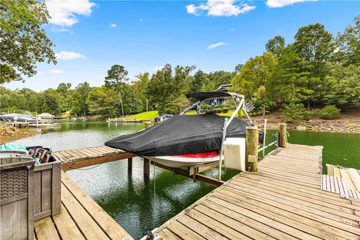 Wooden docks line the calm waterfront, offering direct access to the scenic lake.