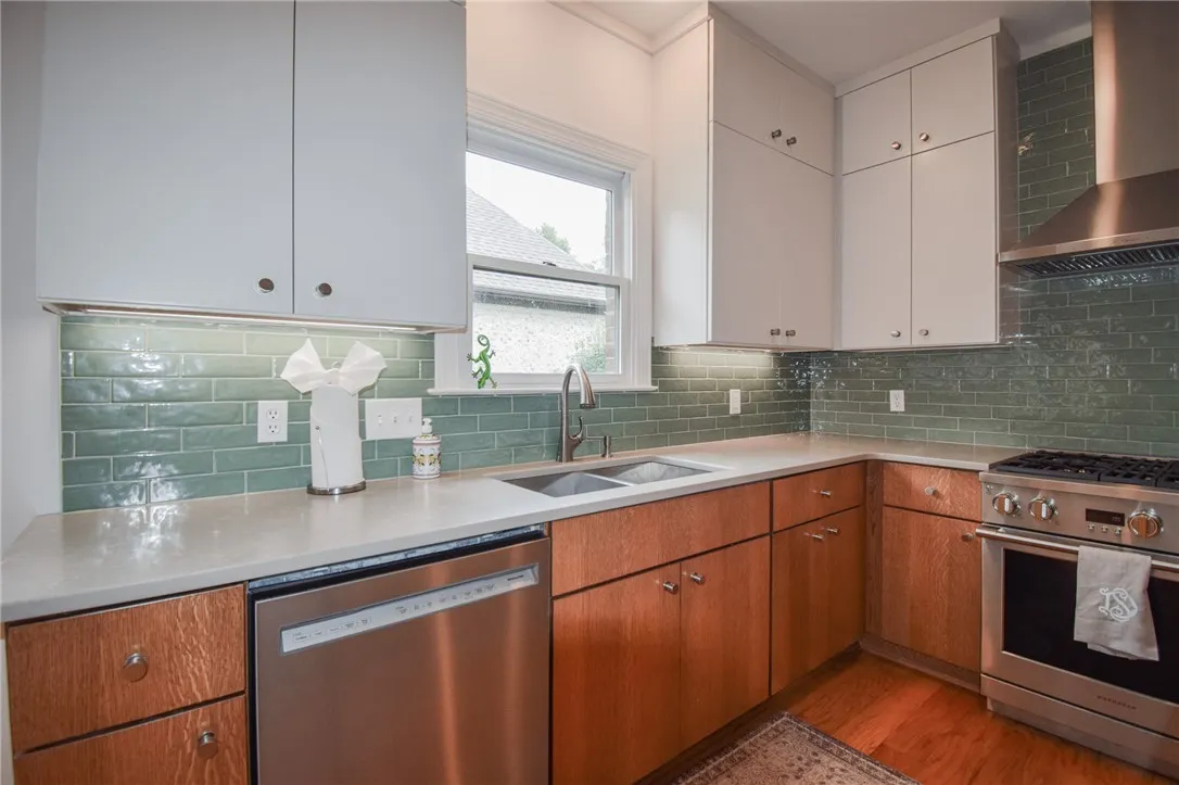 Gleaming stone countertops and classic wood flooring ground this thoughtfully designed workspace.