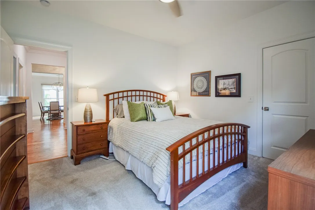 Soft carpeting underfoot defines this comfortable bedroom retreat with classic molding details.