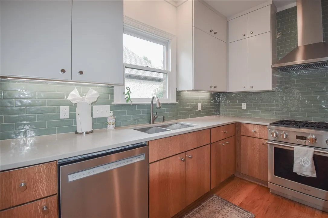 Gleaming stone countertops and a classic subway tile backsplash accent this chef's kitchen.