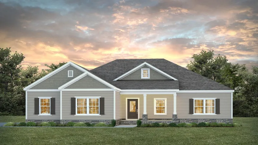 A classic front porch and gabled roofline define the welcoming exterior of this home.