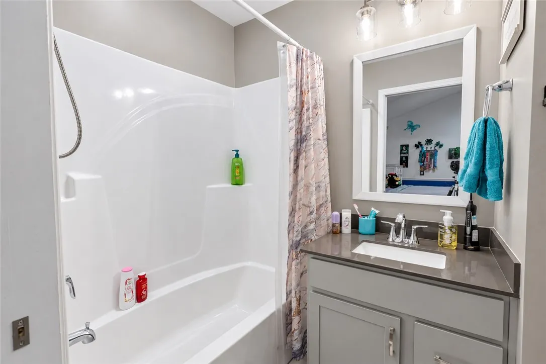 A well-appointed vanity complements the tub and shower combination.