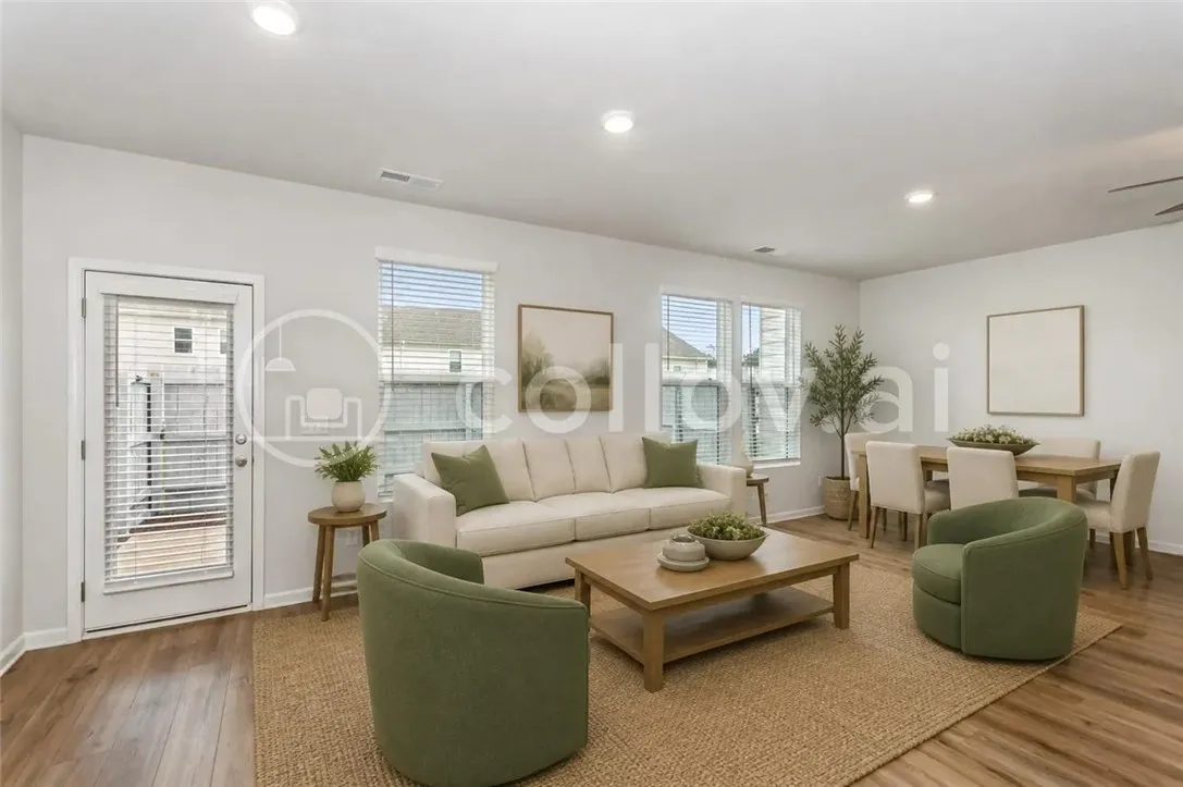 Warm wood flooring and recessed lighting define this inviting open living and dining space. "Virtually Staged"