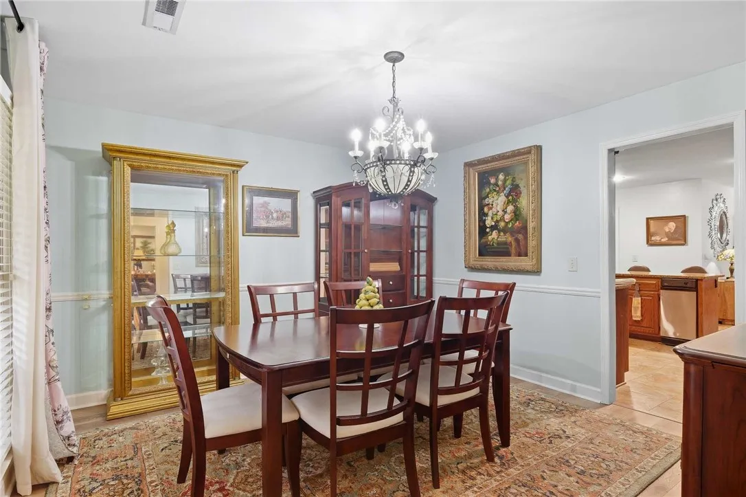 Elegant formal dining space connects seamlessly to the adjacent kitchen.