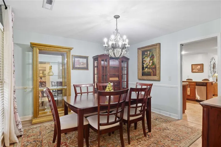 Elegant formal dining space connects seamlessly to the adjacent kitchen.